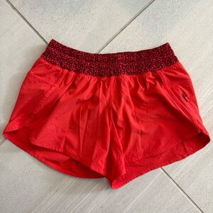 Lululemon tracker IV short. Size 6. Excellent used condition. Red/orange color